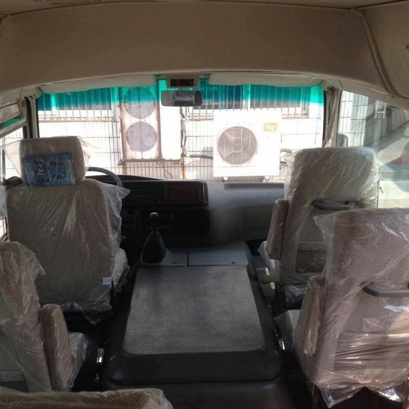 Model 19 Seater RHD Mini Coaster Passenger Bus 70L Oil Tank 7.00R16 Tires Ready to Ship